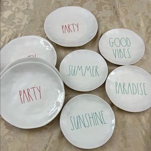 Rae Dunn ceramic plates.4 dinner size  and 4 salad size. Nvr used.sat in cabinet